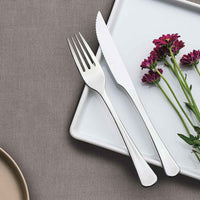 Tramontina Havana haarukka ja veitsi lautasella