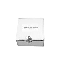 Rolling Sharpener 1000 grit corundum kiekko pakattuna valkoiseen laatikkoon, valmis toimitettavaksi.