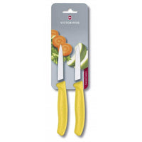 Victorinox Kuorimaveitsi Setti - 8 cm, 2 kpl Swiss Classic keltaisella kahvalla, vihanneskuvituksella varustetussa pakkauksessa.
